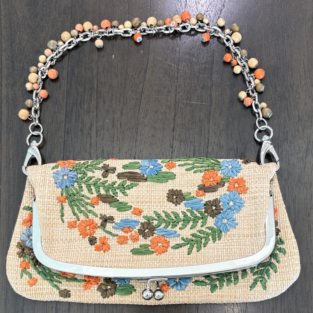 Twisted straw or raffia clutch and handmade embroidery